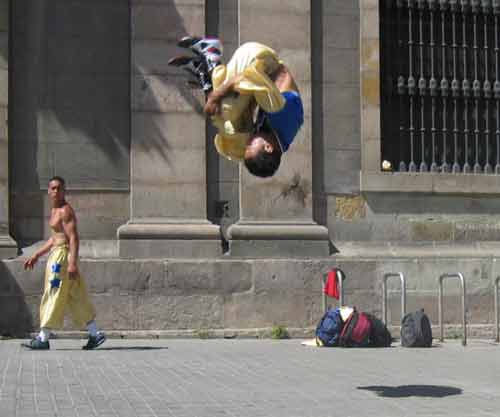 A street performer in Las Ramblas, mid-somersault