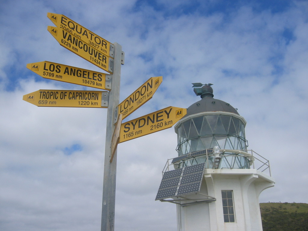 Lighthouse, signs at Cape Reigna, New Zealand's North Island