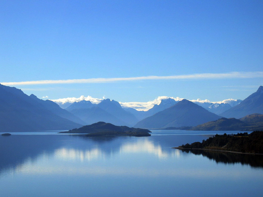Reflections of Southern Alps in Lake Wakatipu, New Zealand's South Island