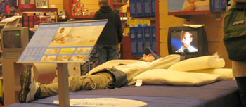 Ian trying out comfy bedding in Brookstones