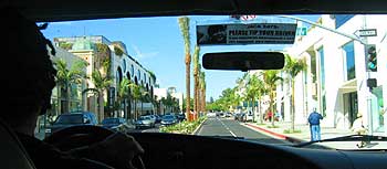 Driving down Rodeo Drive, Coolio-lookalike Marcus at the wheel