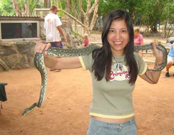 Mand holding python.