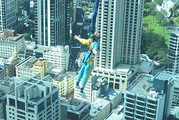 Someone jumping off the Sky Tower in full harness.