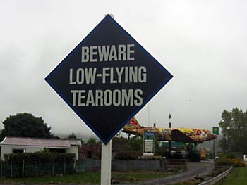 Sign reads: Beware - low-flying tea rooms