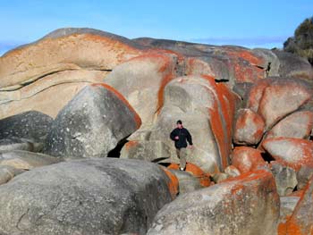 Ian running along the rocks, Bay of Fires.