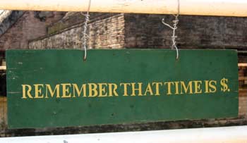 Sign that reads 'Remember that Time is Money'