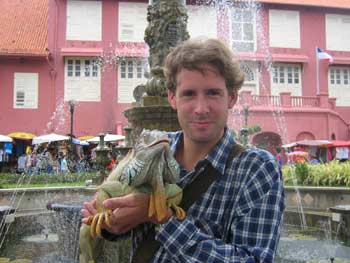 Ian holding an iguana.