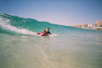 Ian rides the waves at Bondi, body-board style