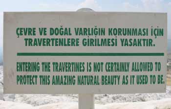 Sign at Pamukalle. It reads 'Entering the Travertines is not certainly allowed to protect this amazing natural beauty as it used to be.'